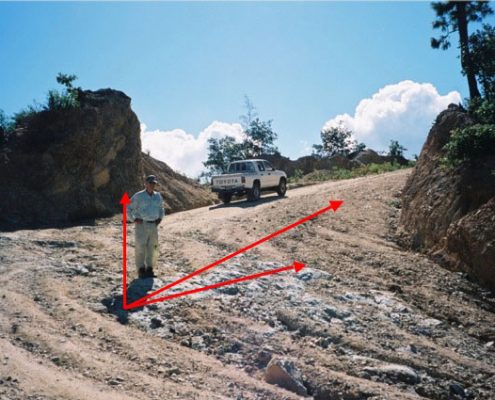 El Cerrito Oeste Zone with average trench grade of 28.5 g/t Au in dip slope above road. Quartz stockwork and veining exposed in cuts and road bed.
